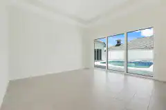 Palm-Coast-Courtyard-Home-Family-Room-with-Courtyard-View