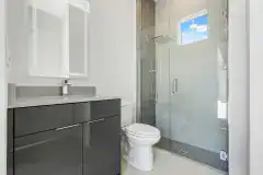 Contemporary-Spec-Home-Pool-House-Bathroom